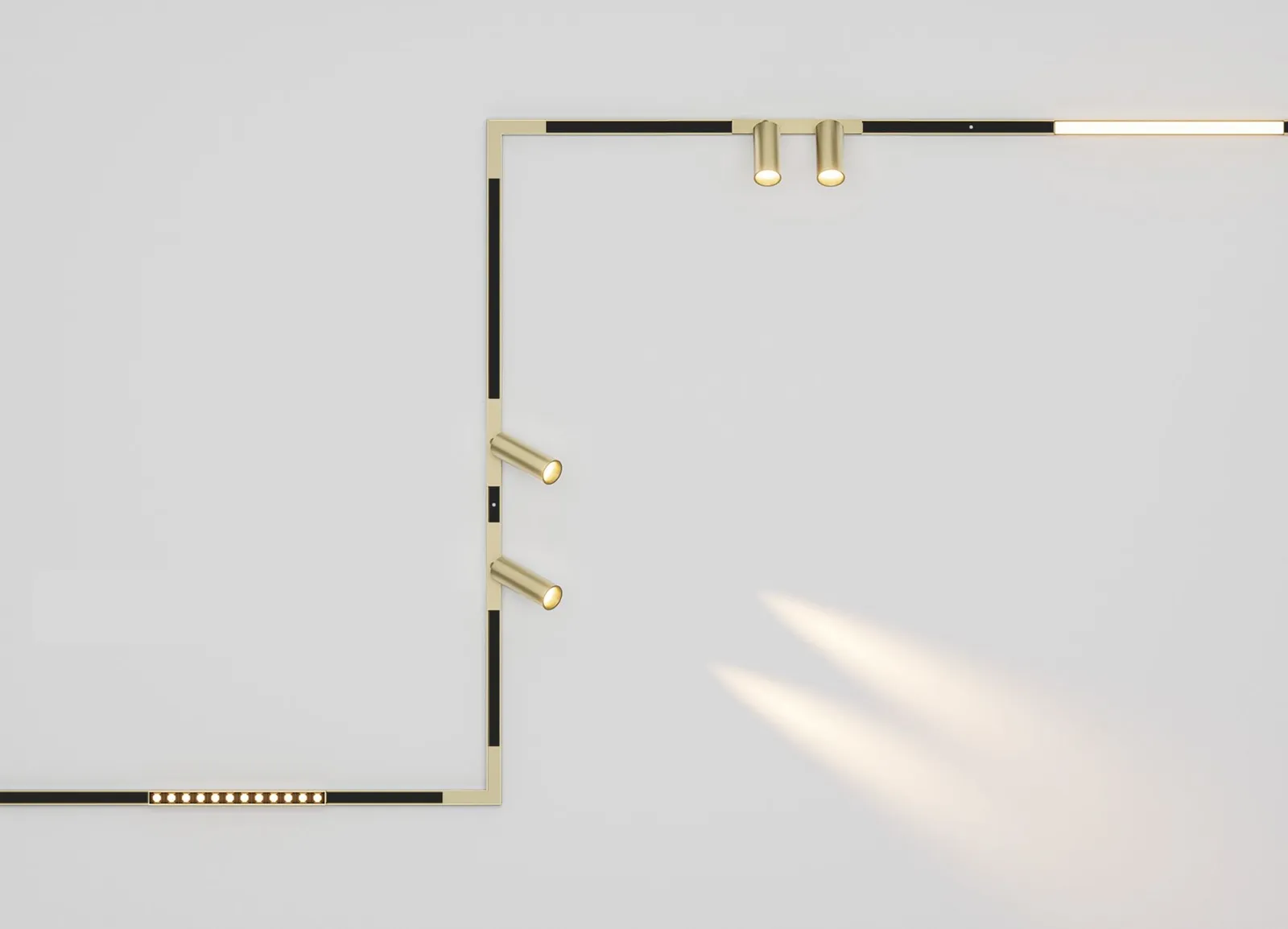 Mini.12 magnetic track turning a corner on a white ceiling, with gold spot modules