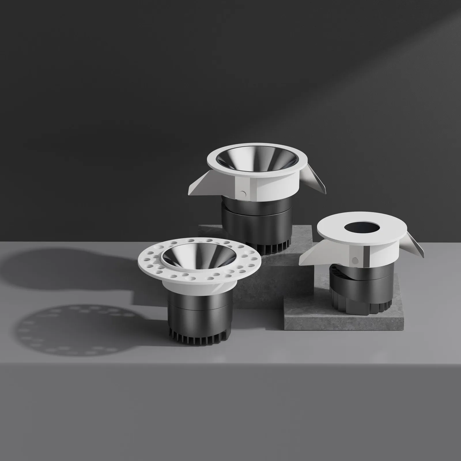 Staron spotlights with square and round trims on a grey stand